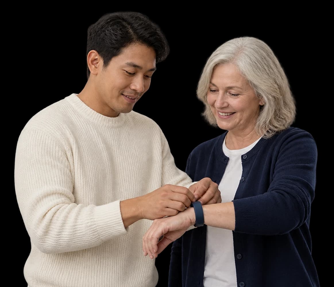 A product manager fastens a fitness band onto a tester’s wrist.