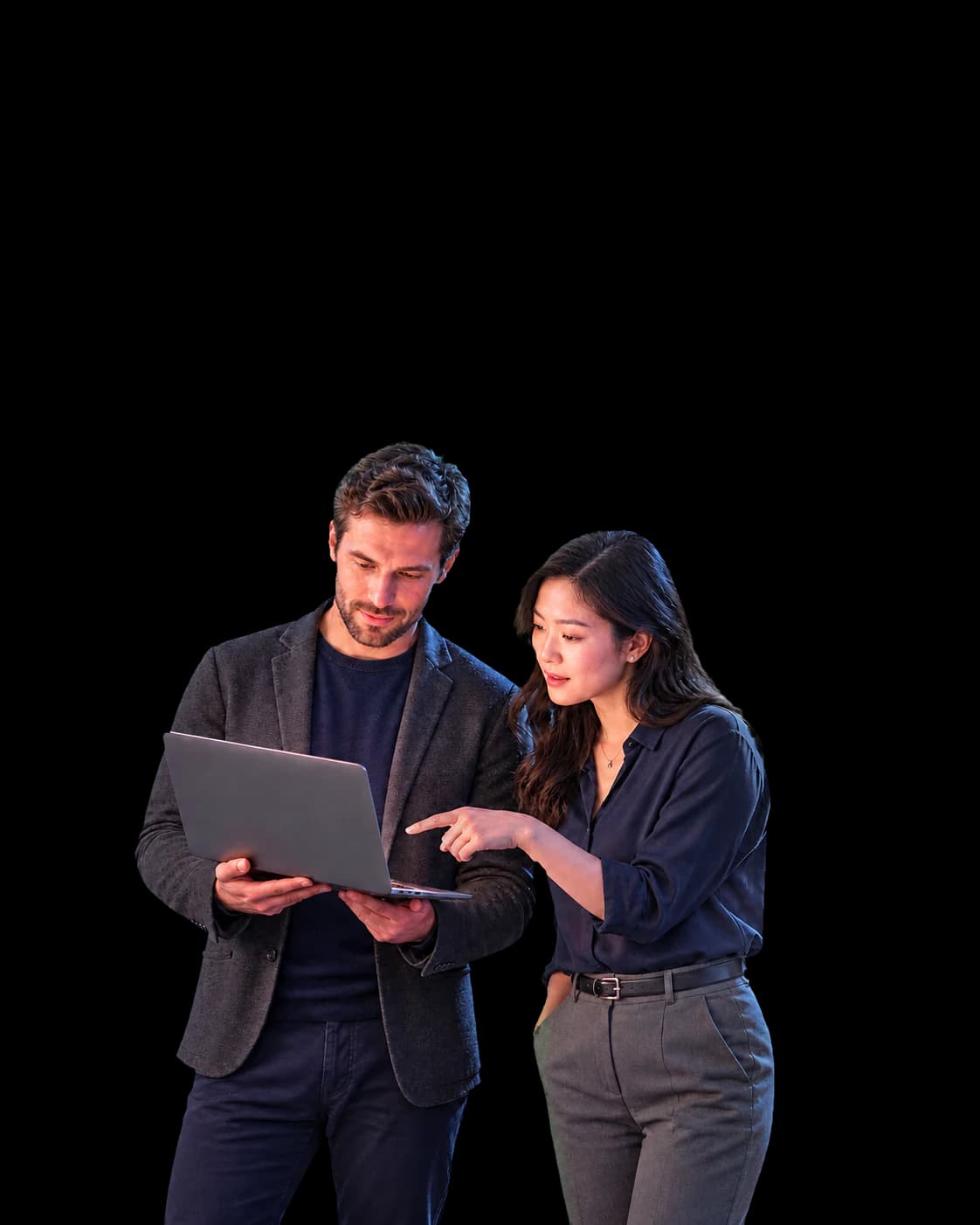 Two startup leaders reviewing insurance information on a laptop.